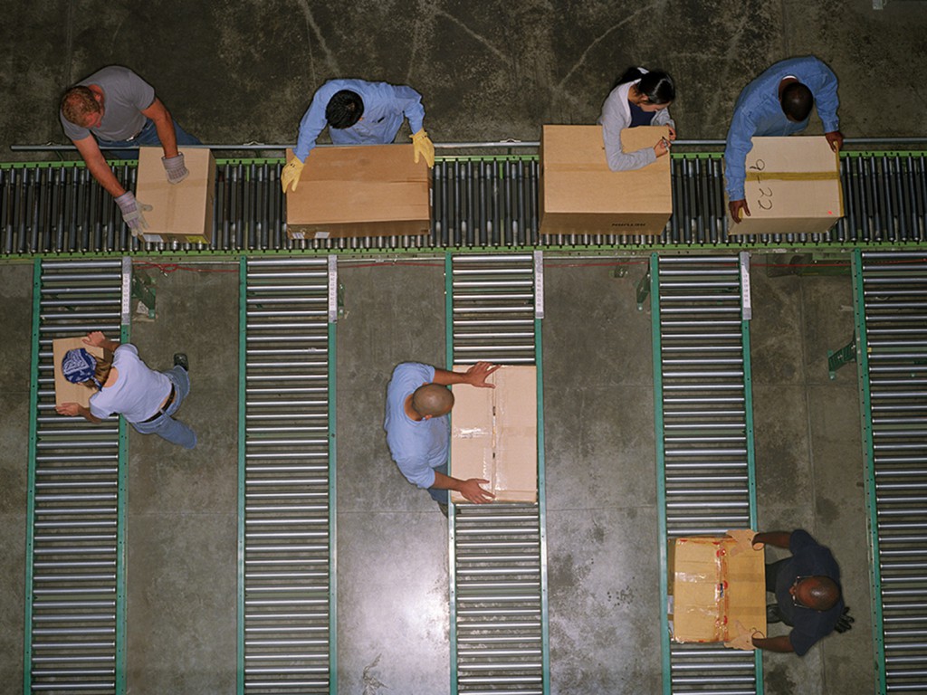 conveyor belt workers --- Image by ?Royalty-Free/Corbis